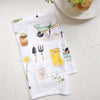 Emily Lex Studio Garden Tea Towel - product shown folded on table next to dish
