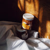 Sqirl Yuzu Passionfruit Fruit Spread - two products stacked on blanket