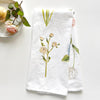 Emily Lex Studio Garden Flowers Tea Towel - product shown folded next to dish with flower on it