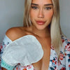 Folia Body Exfoliating Tan Removal Mitt - model shown wearing product
