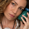 Foile Skin Sponge Serum - model shown holding product next to face