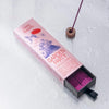 Oddly Specific Low Smoke Incense - Garden Party - opened product packaging next to incense stick in holder