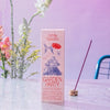 Oddly Specific Low Smoke Incense - Garden Party - product shown in front of plant and incense on wet table