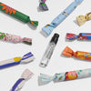Maison Matine Discovery Set (11 x 2 ml) showing wrapped vials in packaging and one unwrapped vial