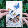 Close up of model holding card of Moth & Myth Pacific Northwest Butterfly Set (3 pcs)