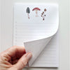 Emily Lex Studio Mushroom Checklist Notepad - model shown folding page of product