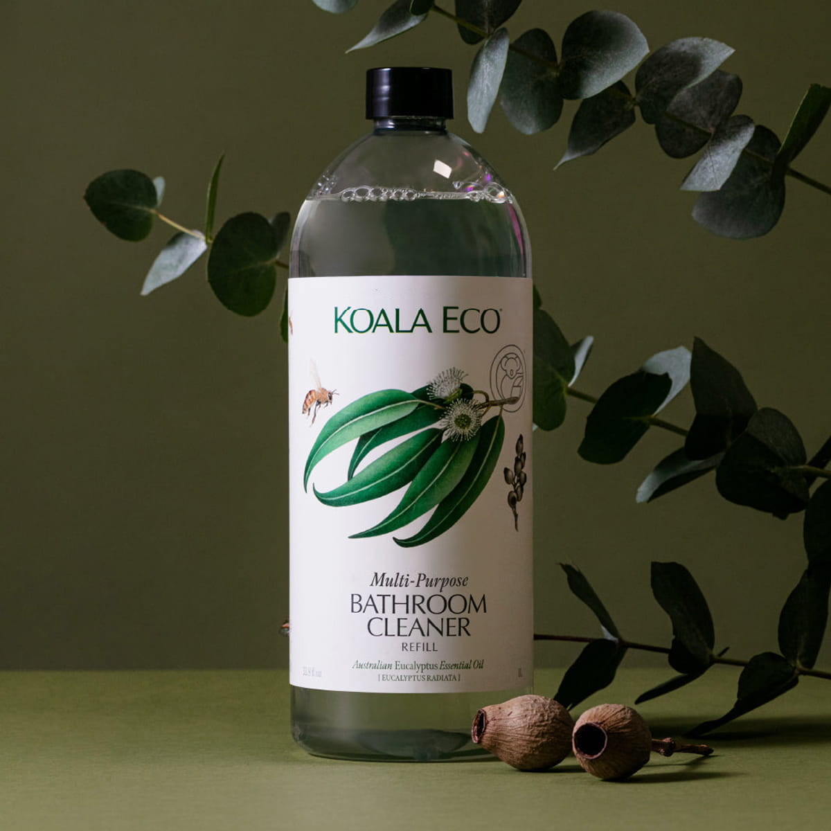 Koala Eco Multi-Purpose Bathroom Cleaner - Eucalyptus Essential Oil (33.8 oz) - product shown on green background with plants. 