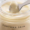 Furtuna Skin Cleansing Oil Balm - product shown being spooned out of container