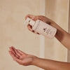 Innersense Organic Beauty Awaken Body Wash - model shown dispensing product into hand