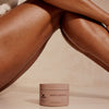 Innersense Organic Beauty Blissful Body Butter - product shown underneath leg.