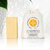 The Edinburgh Natural Skincare Company St Clements Cold Processed Soap - product shown next to packaging and leaf