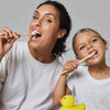 Mother and daughter shown using Davids Hydroxi Kids + Adults Nano Hydroxyapatite Premium Toothpaste - Mild Mint
