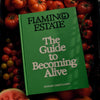 Flamingo Estate Organics The Guide to Becoming Alive - product shown on top of tomatoes