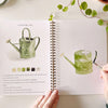 Emily Lex Studio Garden Watercolor Workbook - model shown painting inside product