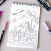 Antiquaria Cosmic Cowgirl Premium Coloring Book - product interior page shown next to pens