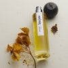 Hima Jomo Autumn In Lhoka Eau de Parfum - product shown next to flowers