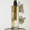 Hima Jomo Loon Eau de Parfum - product shown in front of flowers