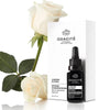 Odacite Optimum Hydration Serum - A Winter In Paris (15 ml) - product shown next to packaging and flowers