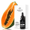 Odacite Sun Recovery Radiance Serum - A Summer in Hossegor - product and packaging shown next to papaya 