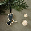 Magpie Mischief Hummingbird Ornament - product shown hanging from branch 