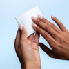 Clean Skin Club Cloud Pads Frictionless Face Pads - model shown holding product
