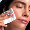 Clean Skin Club Cloud Pads Frictionless Face Pads - model shown using product on face