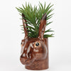 Quail Ceramics Hare Pencil Pot - product shown with plant inside it