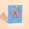 Carolyn Suzuki Goods Mini Bouquet Mother's Day Card - product shown opened on orange background