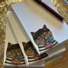 Carpe Diem Papers Bonjour Chat Le Petit Notepad - three products shown stacked with pen on top