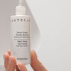 Close up of model holding Chantecaille Blanc Peony Face Serum Dark Spot Corrector (30 ml)