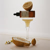 HYEJA Yuja Vitamin C Brightening Serum - product shown on top of glass with fruit
