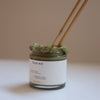 HYEJA Matcha Mud Cream Mask - sticks shown sticking out of jar