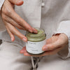 HYEJA Matcha Mud Cream Mask - model shown putting fingers in jar