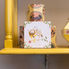StoryTiles Small Tile - Welcome Lovely Baby (1 pc) - product shown on wooden table