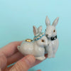 Camp Hollow Love Bunnies Wedding Cake Topper - model shown holding product