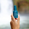 Ursa Major Forest Water Hyaluronic Serum  - model shown holding product 