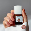 Kure Bazaar Le Vernis Serum Rose - Le Rose 07 (10 ml) - model shown holding product