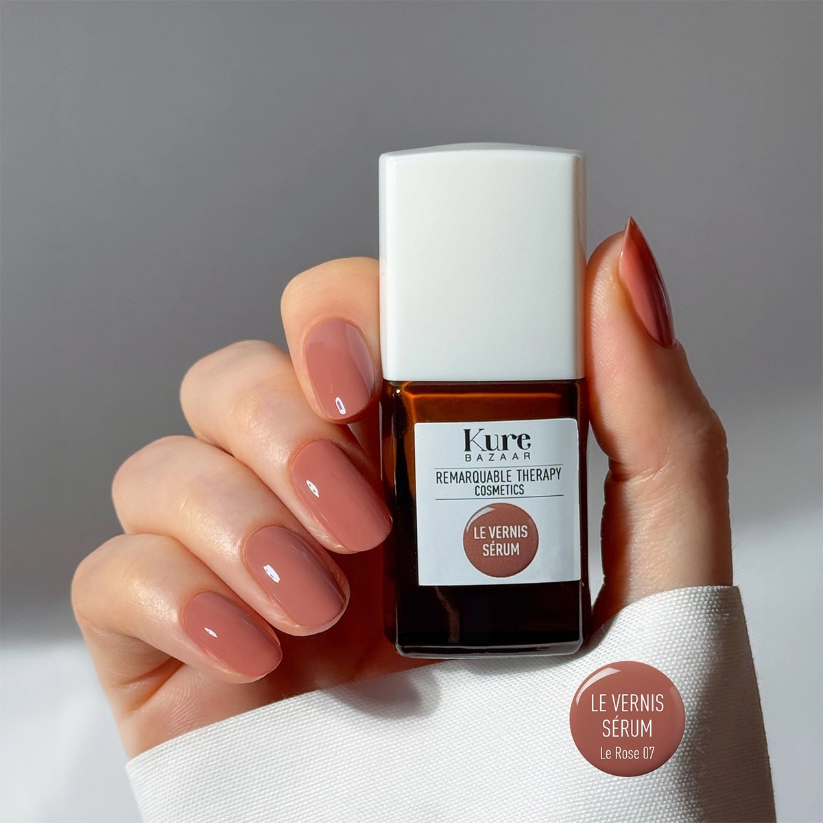 Kure Bazaar Le Vernis Serum Rose - Le Rose 07 (10 ml) - model shown holding product