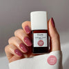 Kure Bazaar Le Vernis Serum Rose - Le Rose 02 (10 ml) - model shown holding product