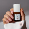 Kure Bazaar Le Vernis Serum Rose - Le Rose 01 (10 ml) - model shown holding product