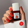 Kure Bazaar Le Vernis Serum Sunset - L'Orange 02 (10 ml) - model shown holding product