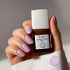 Kure Bazaar Le Vernis Serum Pastel - Le Pastel 01 (10 ml) - model shown holding product