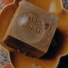 Flamingo Estate Organics Manuka Honey Soap Brick - product shown on dish