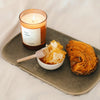 Versatile Paris Bee Mine Scented Candle - product shown on tray next to honeycomb and buttered toast