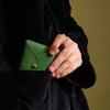 Immodest Cotton Scallop Wallet - Pine + Robin's Egg - model shown holding product
