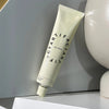 Artifact Hand & Nail Cream - Big Wave - product shown near ceramics
