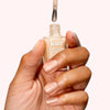 Londontown Tinted Fortifying Ridge Filler - Apricot Beige - model shown holding product