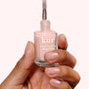 Londontown Tinted Fortifying Ridge Filler - Petal Pink - model shown holding product
