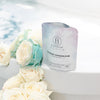 Bathorium Midnight Superbloom Crush Bath Soak - product shown opened on bath tub