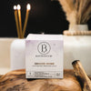Bathorium Snooze Bath Bomb - product packaging shown next to incense on top of wood